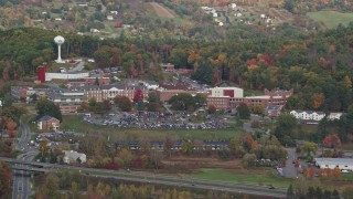 AX150_472E - 5.5K aerial stock footage flying by White River Junction VA Medical Center, autumn, White River Junction, Vermont