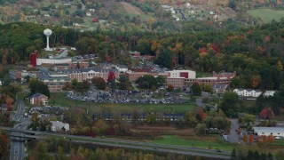 AX150_473 - 5.5K aerial stock footage of White River Junction VA Medical Center, colorful trees, autumn, White River Junction, Vermont
