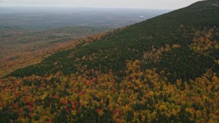 AX151_112 - 5.5K aerial stock footage flying over colorful forest, Mount Kearsarge, autumn, Wilmot, New Hampshire