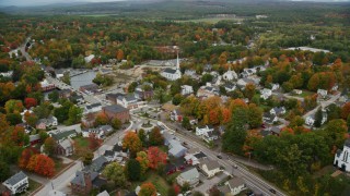 AX151_150 - 5.5K stock footage aerial video orbiting church near Main Street, small town, autumn, Penacook, New Hampshire