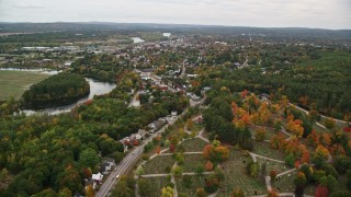 AX151_157E - 5.5K aerial stock footage flying over State Street, cemetery, homes in autumn, Concord, New Hampshire