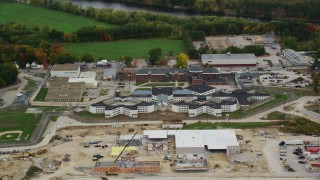 AX151_159 - 5.5K aerial stock footage orbiting the New Hampshire State Prison, autumn, Concord, New Hampshire