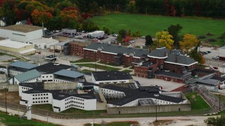 AX151_173 - 5.5K aerial stock footage orbiting the New Hampshire State Prison, autumn, Concord, New Hampshire