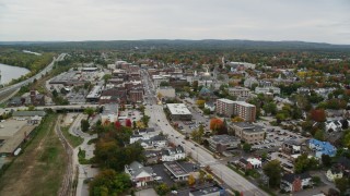 AX151_180 - 5.5K stock footage aerial video flying over downtown, by St Paul's Church, New Hampshire State House, autumn, Concord, New Hampshire
