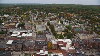 AX151_181E - 5.5K aerial stock footage orbiting St Paul's Church, New Hampshire State House, downtown, autumn, Concord, New Hampshire