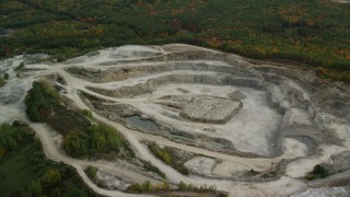 AX152_011 - 5.5K aerial stock footage flying by a quarry, colorful foliage in autumn, Bow, New Hampshire