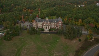 AX152_019 - 5.5K aerial stock footage approaching, flying over Mercy Hall, Mount Saint Mary College, autumn, Hooksett, New Hampshire