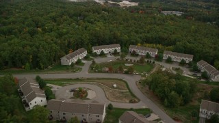 AX152_022 - 5.5K aerial stock footage approaching condominiums and tilt down, autumn, Hooksett, New Hampshire