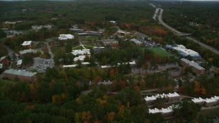 AX152_033 - 5.5K stock footage aerial video flying over Southern New Hampshire University, pan left, autumn, Hooksett, New Hampshire