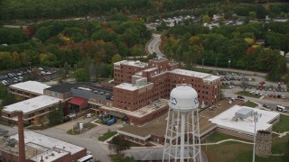 AX152_036E - 5.5K aerial stock footage flying by Veterans Affairs Medical Center, autumn, Manchester, New Hampshire