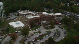 AX152_037 - 5.5K stock footage aerial video orbiting the Veterans Affairs Medial Center, autumn, Manchester, New Hampshire