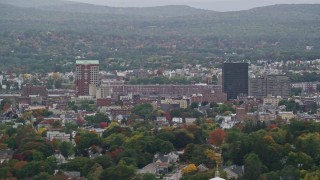AX152_045E - 5.5K aerial stock footage of City Hall Plaza, Hampshire Plaza, downtown office towers, autumn, overcast, Manchester, New Hampshire