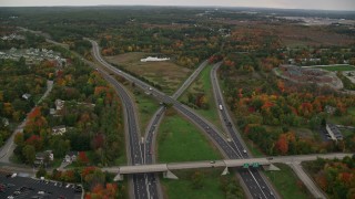 AX152_047 - 5.5K aerial stock footage flying over Interstate 93, Interstate 293 interchange, autumn, overcast, Manchester, New Hampshire
