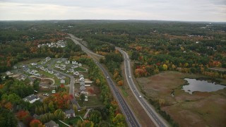 AX152_048 - 5.5K aerial stock footage flying over Interstate 93, brightly colored foliage, autumn, Manchester, New Hampshire