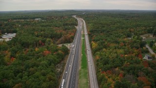 AX152_063E - 5.5K aerial stock footage flying over Interstate 93, forest, autumn, overcast, Derry, New Hampshire