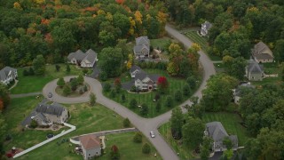 AX152_067 - 5.5K aerial stock footage tilting to bird's eye view over suburban homes, autumn, Windham, New Hampshire