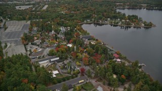 AX152_070E - 5.5K aerial stock footage approach and orbit Canobie Lake Park, colorful foliage in autumn, Salem, New Hampshire