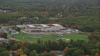 AX152_079 - 5.5K aerial stock footage flying by Salem High School, football practice, autumn, Salem, New Hampshire