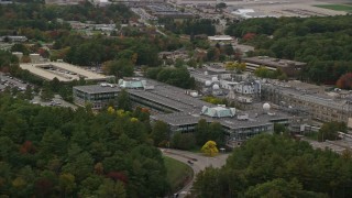 AX152_170 - 5.5K aerial stock footage flying by MIT Lincoln Laboratory, autumn, overcast, Lexington, Massachusetts
