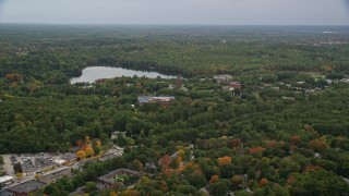 AX152_178 - 5.5K aerial stock footage  approaching Lake Waban, Green Hall, autumn, overcast, Wellesley College, Massachusetts