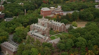AX152_182 - 5.5K aerial stock footage orbiting Tower Court, colorful foliage, autumn, Wellesley College, Massachusetts