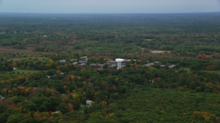 AX152_190 - 5.5K stock footage aerial video approaching Medfield State Hospital, autumn, overcast, Medfield, Massachusetts