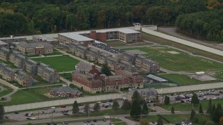 AX152_228 - 5.5K aerial stock footage of Massachusetts Correctional Institution at Norfolk and fall foliage,  Massachusetts