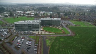 AX153_002 - 5.5K aerial stock footage flying over Office Buildings, Tech Company Synopsis Inc, autumn, Hillsboro, Oregon