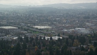 AX153_005 - 5.5K aerial stock footage flying by shopping centers on a cloudy day, autumn, Beaverton, Oregon
