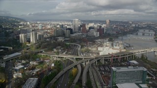 AX153_036E - 5.5K aerial stock footage flying over high-rises in South Waterfront and Interstate 5 toward Downtown Portland, Oregon