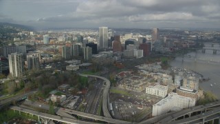 AX153_037 - 5.5K stock footage aerial video flying over Interstate 5 and 405 interchange toward Downtown Portland, Oregon