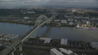 AX153_042 - 5.5K stock footage aerial video flying by the Fremont Bridge spanning Willamette River, Portland, Oregon