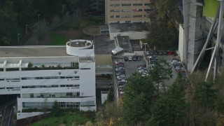 AX153_050 - 5.5K aerial stock footage flying over a gondola at the Oregon Health and Science University, autumn, Portland, Oregon