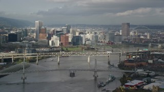 AX153_051E - 5.5K aerial stock footage crossing the Willamette River with views of the city skyline, autumn, Downtown Portland, Oregon