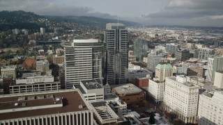 AX153_057 - 5.5K aerial stock footage flying over Fox Tower, tracking Park Avenue West Tower, autumn, Downtown Portland, Oregon