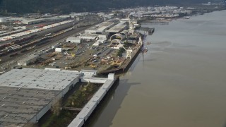 AX153_061 - 5.5K aerial stock footage flying along a shipping area on the river, Northwest Portland, Oregon