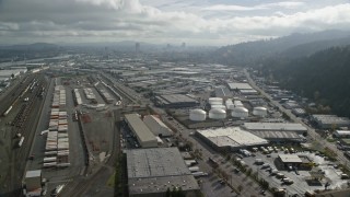 AX153_063E - 5.5K aerial stock footage flying over warehouses in an industrial area, Northwest Portland, Oregon