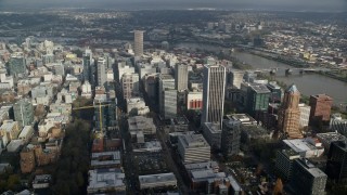 AX153_073E - 5.5K aerial stock footage orbiting skyscrapers in Downtown Portland, Oregon