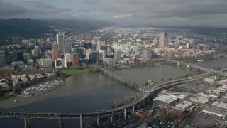 AX153_083 - 5.5K aerial stock footage of Hawthorne Bridge and skyscrapers in Downtown Portland, Oregon