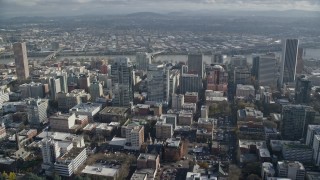 AX153_097E - 5.5K aerial stock footage flying by Park Avenue West and Fox Tower to approach Morrison Bridge in Downtown Portland, Oregon