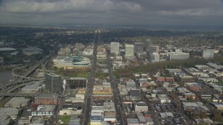 AX153_101 - 5.5K stock footage aerial video passing the Oregon Convention Center and office buildings in Lloyd District, Portland, Oregon