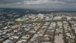 AX153_101E - 5.5K aerial stock footage passing the Oregon Convention Center and office buildings in Lloyd District, Portland, Oregon