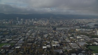 AX153_103 - 5.5K stock footage aerial video approaching Burnside Bridge to Downtown Portland, Oregon