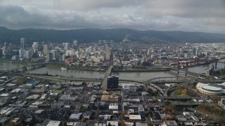 AX153_103E - 5.5K aerial stock footage approaching Burnside Bridge to Downtown Portland, Oregon
