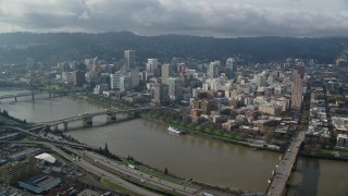 AX153_105E - 5.5K aerial stock footage crossing the Willamette River toward Downtown Portland, Oregon
