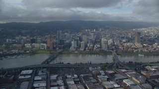 AX153_127 - 5.5K stock footage aerial video of bridges spanning Willamette River and skyscrapers in Downtown Portland, Oregon