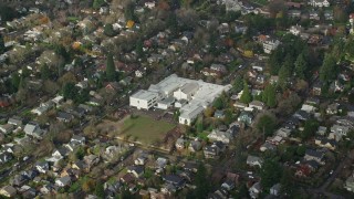 AX153_130 - 5.5K aerial stock footage of Alameda Elementary School in Northeast Portland, Oregon