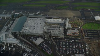 AX153_135 - 5.5K aerial stock footage of a bird's eye view of rooftop parking at Portland International Airport in Oregon