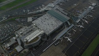 AX153_136 - 5.5K aerial stock footage flying away from Portland International Airport in Oregon