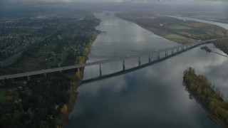 AX153_138 - 5.5K aerial stock footage approaching I-205 Bridge spanning Columbia River in Vancouver, Washington